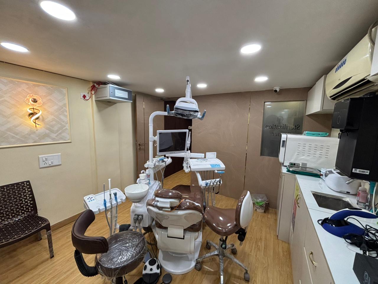Wide view of the operatory with the dental chair and sterilization bay